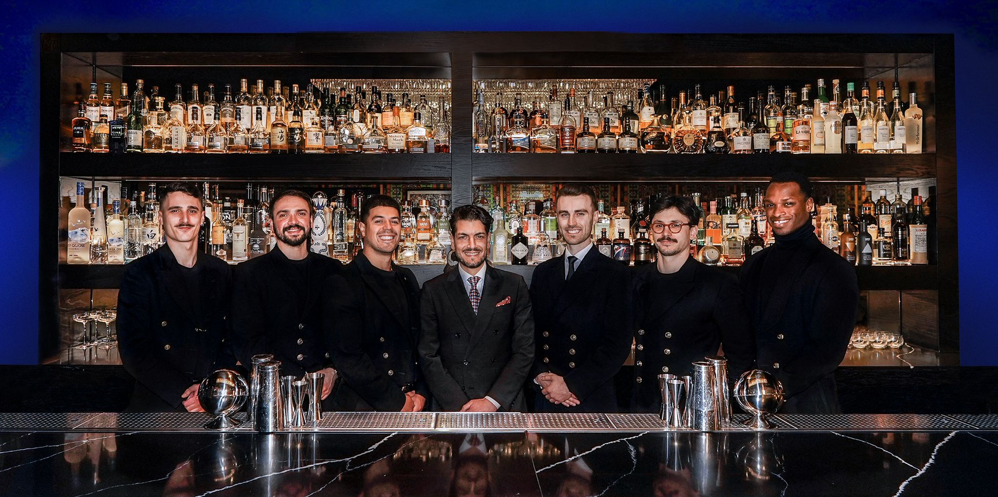 The HUX Kensington bar team lined up behind the bar